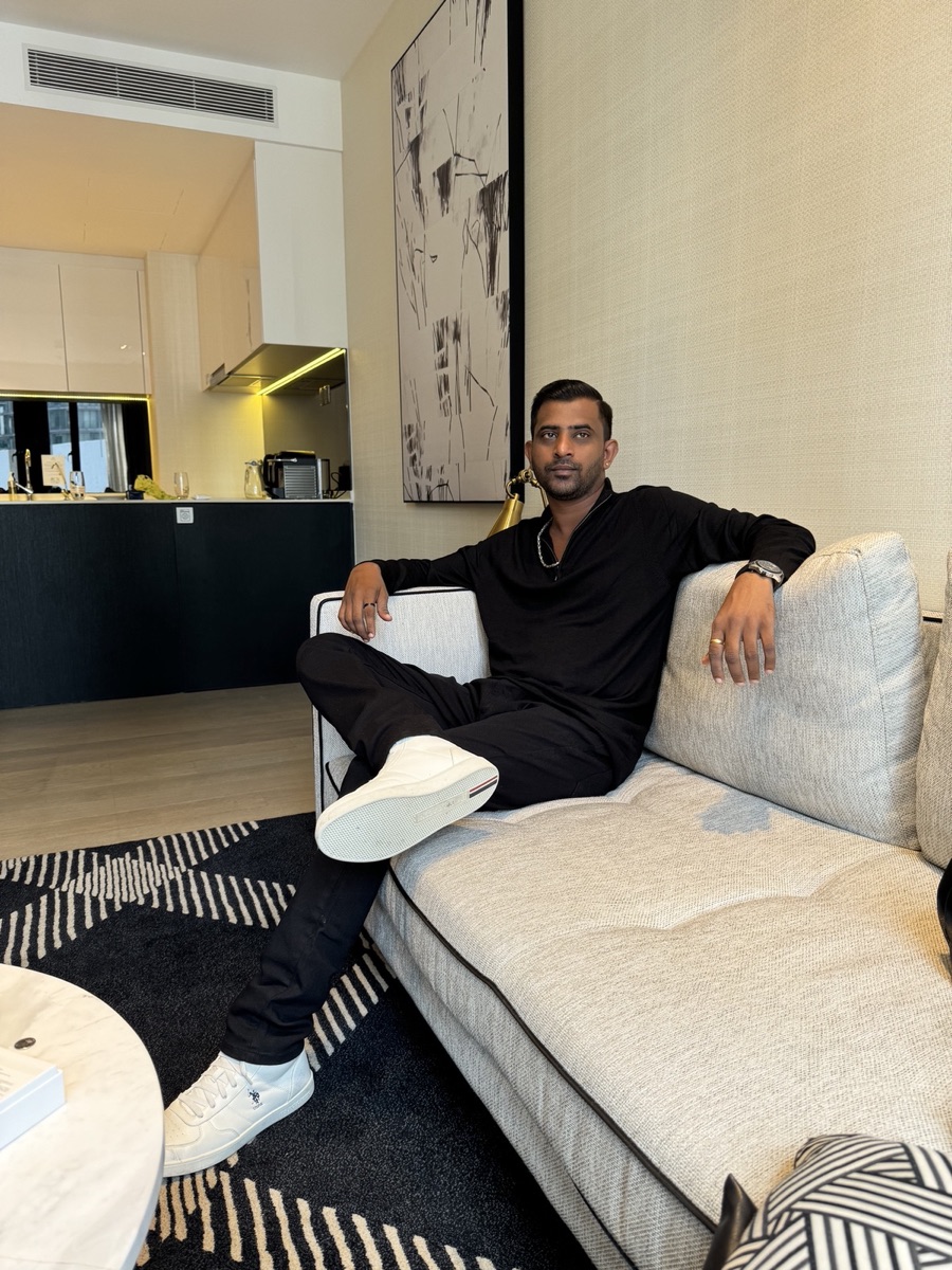 Soundhar Raj seated in a relaxed interior setting